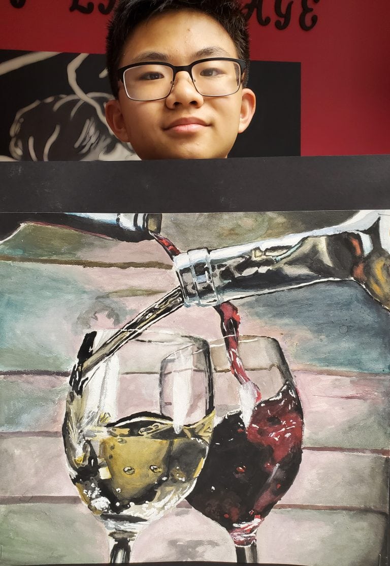 Young boy holding gouche art work of two wine bottles pouring wine in to wine glasses