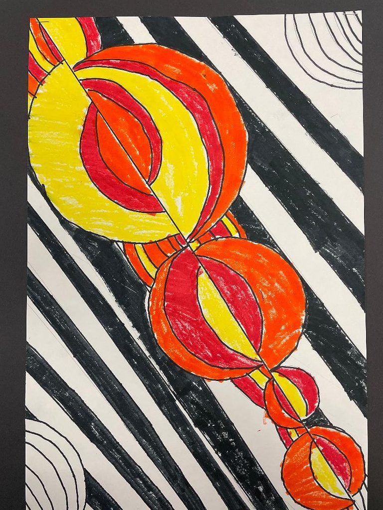 geometric art drawing made with black, red, orange and yellow markers