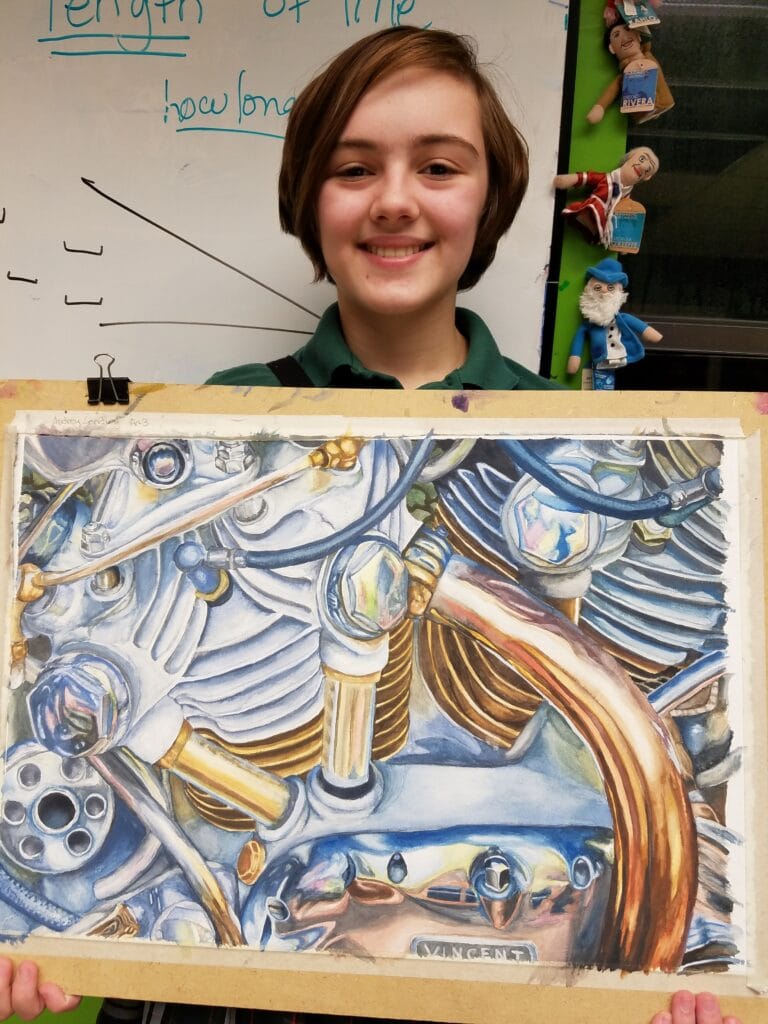 Student holding Gouache Artwork of a car's engine