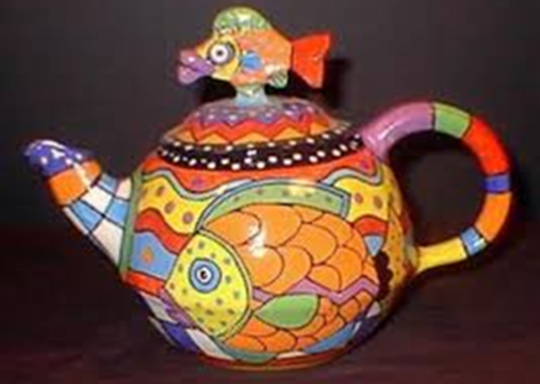 Colorful teapot made of clay and glaze